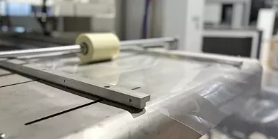 Sheet conveying device for plastic cup making machine